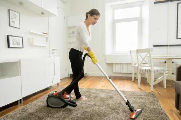 woman-in-casual-wear-vacuum-cleaning-the-carpet-1163-2428
