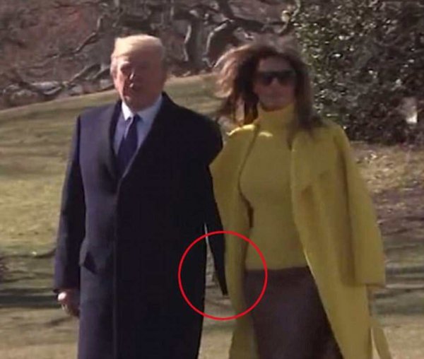 4b81a43b00000578-5652377-nope-melania-kept-her-hand-inside-her-coat-and-pulled-it-backwar-a-12-1524602689223