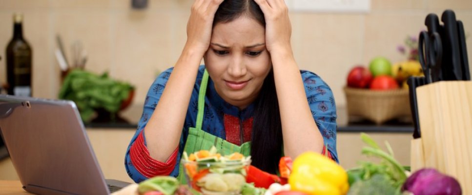 stressed-young-woman-in-kitchen
