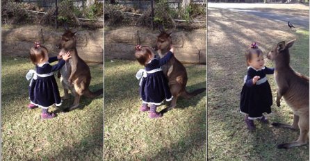 Djevojčica i klokan u zagrljaju