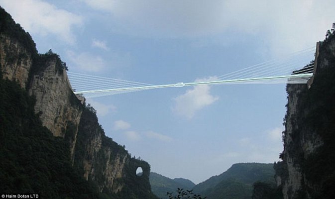 28dcc37f00000578-3087955-the-dizzying-walkway-is-suspended-between-two-cliffs-in-the-zhan-a-26-1432047864704