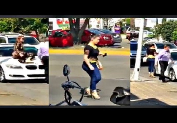 Ljubavna drama: Popela se mužu na auto kako on ne bi mogao otići sa ljubavnicom (VIDEO)