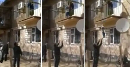 Strašno: Majka bacila bebu sa balkona, otac je jedva uhvatio! (VIDEO)