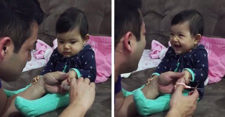 Svaki put kada tata pokušava isjeći bebine nokte, ona radi najsmješniju stvar (VIDEO)