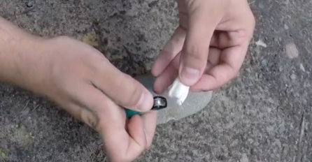 Uzeo je filter od cigarete, zapalio ga upaljačem, a zatim ga protrljao o kamen: Krajnji rezultat će vas ostaviti bez riječi! (VIDEO)