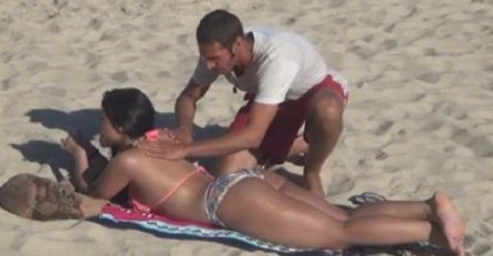 Htio je da kremom namaže djevojku u bikiniju koja je ležala na plaži, ali kada se okrenula uslijedio je šok (VIDEO)