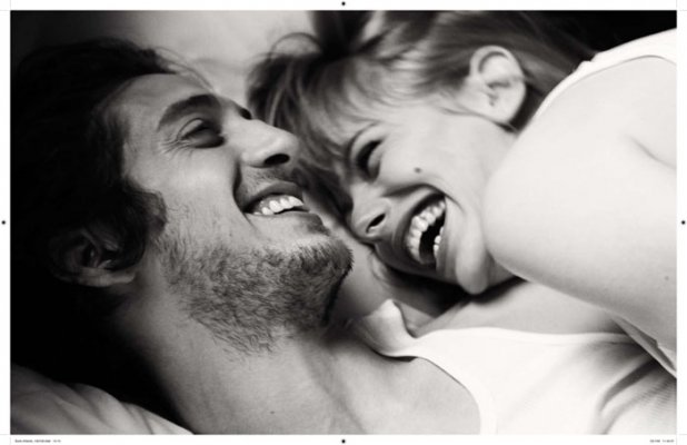 in-bed-couple-laughing-love