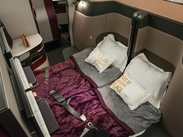 each-seat-comes-with-soft-plush-bedding-including-a-duvet-pillows-and-a-mattress-pad-over-the-seats-when-theyre-in-bed-mode