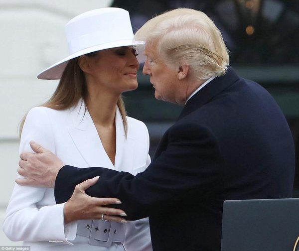 4b7fb42b00000578-5652377-melania-was-happy-to-give-her-husband-a-kiss-to-welcome-him-to-t-a-13-1524602690033