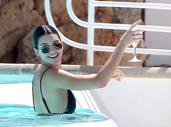 kendall-jenner-black-swimsuit-pool-cannes-may-2018