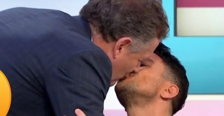 SKANDAL U JUTARNJEM PROGRAMU: Voditelj skočio i poljubio U USTA POZNATOG PJEVAČA! (VIDEO)