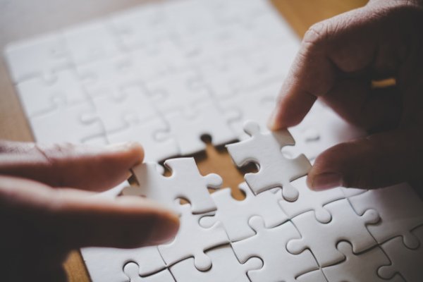 man-hands-connecting-couple-puzzle-piece-office-goals-strategy-2379-1381