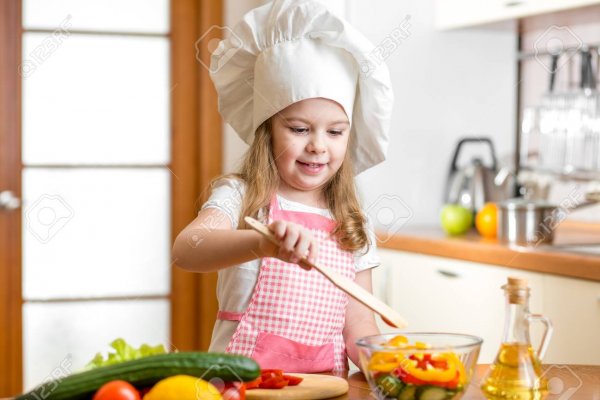 26013438-kid-cooking-at-kitchen