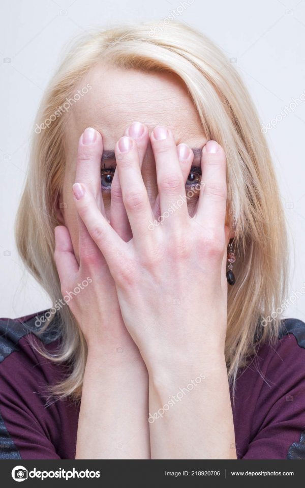 depositphotos-218920706-stock-photo-young-blonde-woman-covering-face