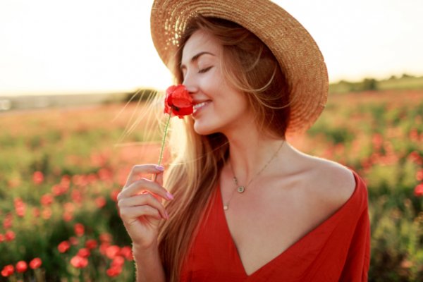 romantic-blonde-woman-with-flower-hand-walking-amazing-poppy-field-warm-sunset-colors-straw-hat-red-dress-soft-colors